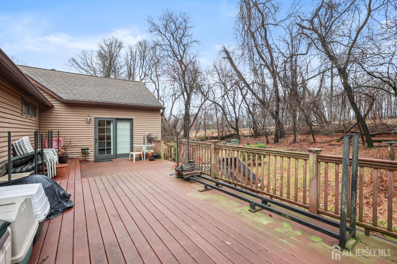 75 Baird Road Millstone Township, NJ 08535 - Photo 22 of 30 a view of a house with wooden deck