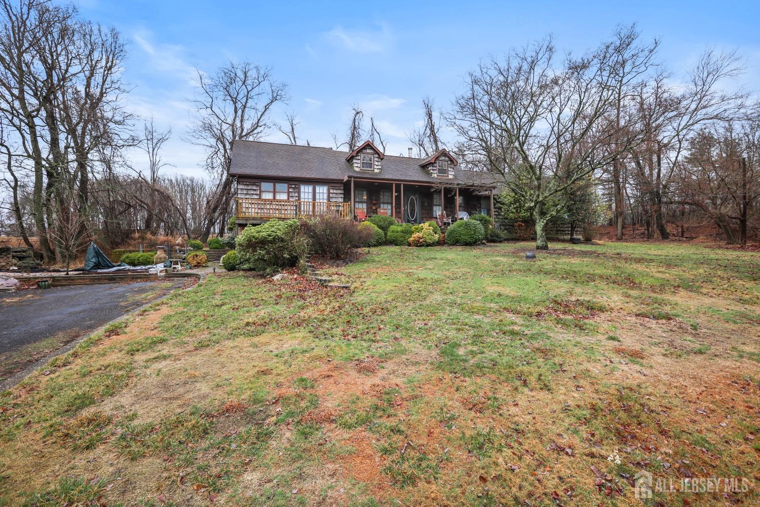 75 Baird Road Millstone Township, NJ 08535 - Photo 25 of 30 a view of a big yard with large trees