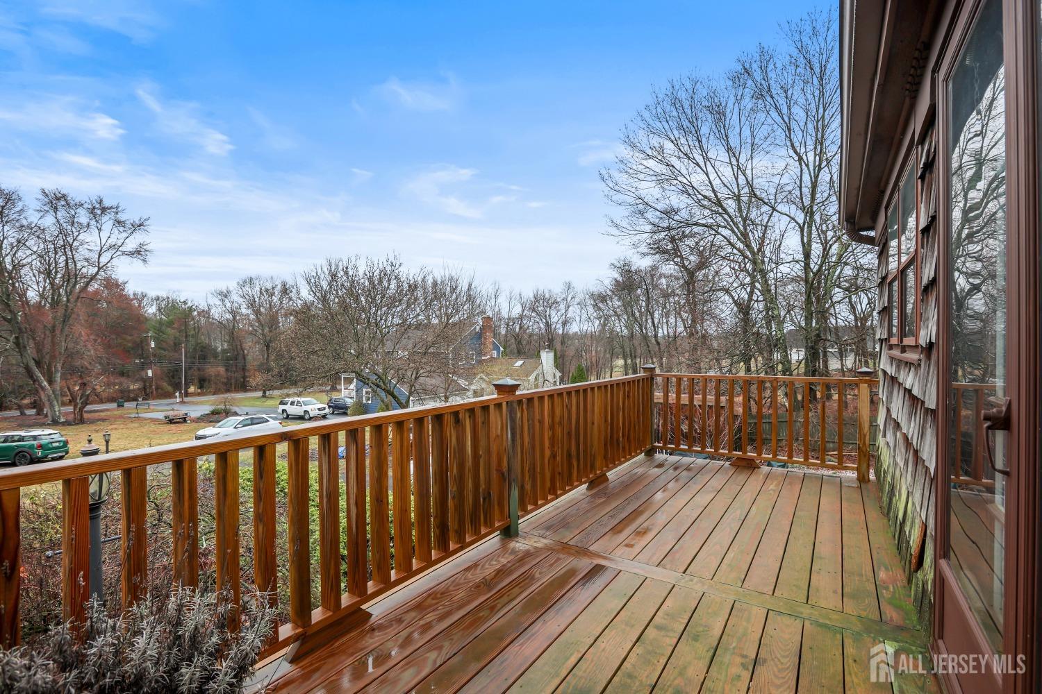 75 Baird Road Millstone Township, NJ 08535 - Photo 26 of 30 a balcony with wooden floor and fence