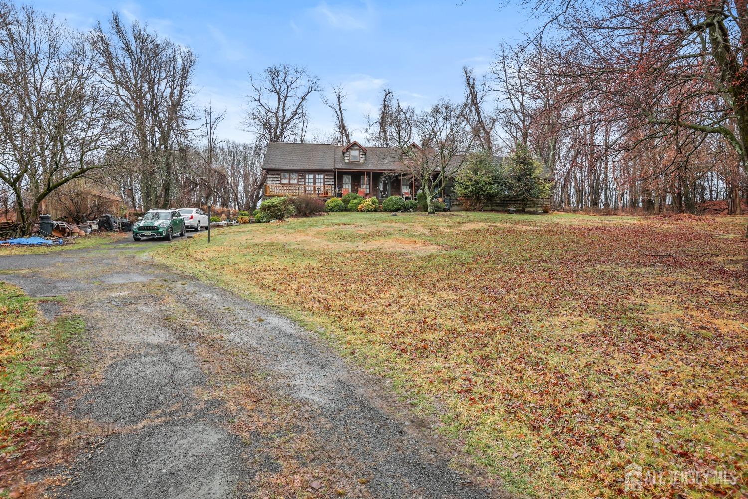 75 Baird Road Millstone Township, NJ 08535 - Photo 28 of 30 a front view of a house with a yard and covered with snow