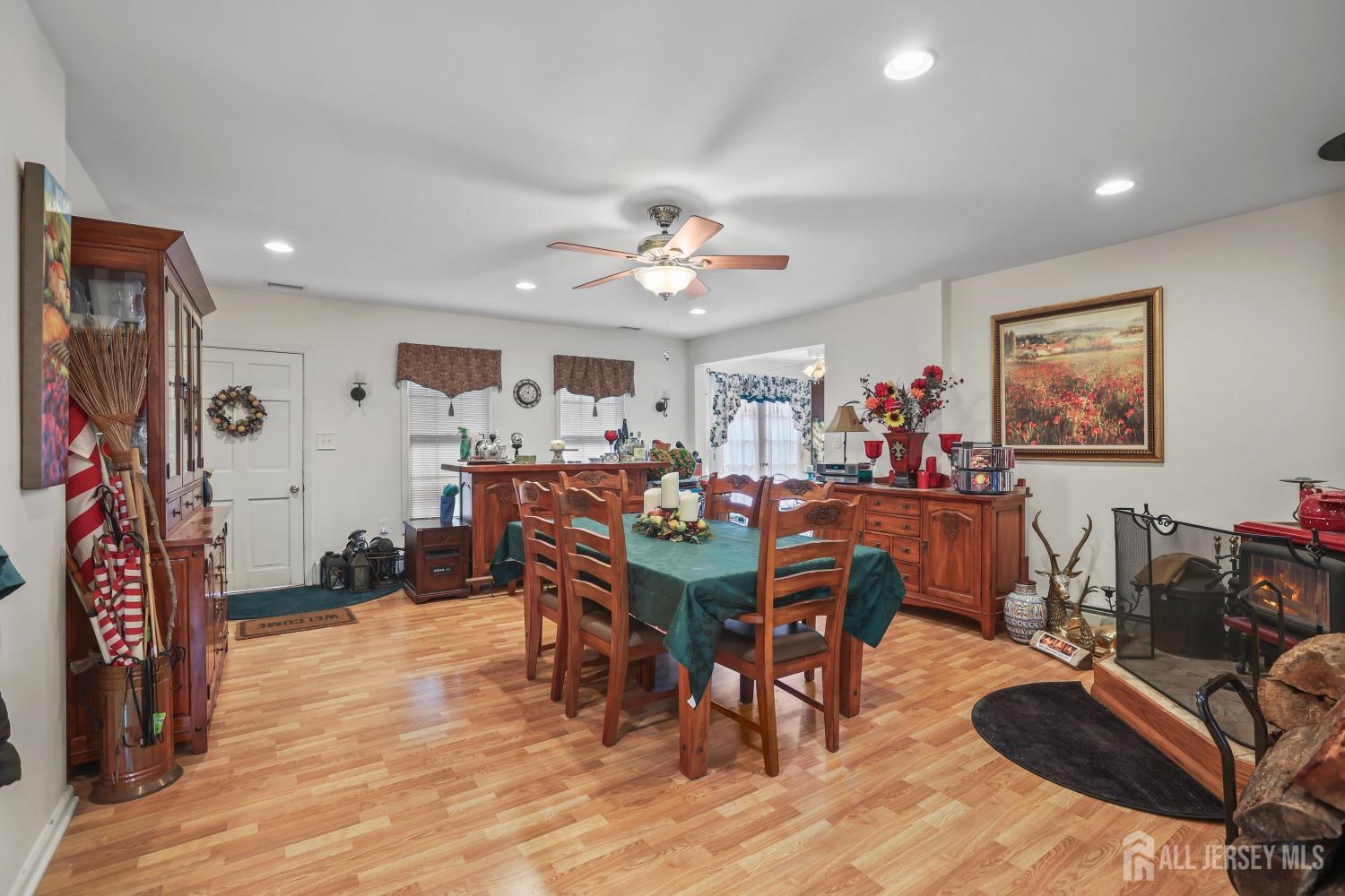 75 Baird Road Millstone Township, NJ 08535 - Photo 10 of 30 a view of a a dining room with furniture window and wooden floor