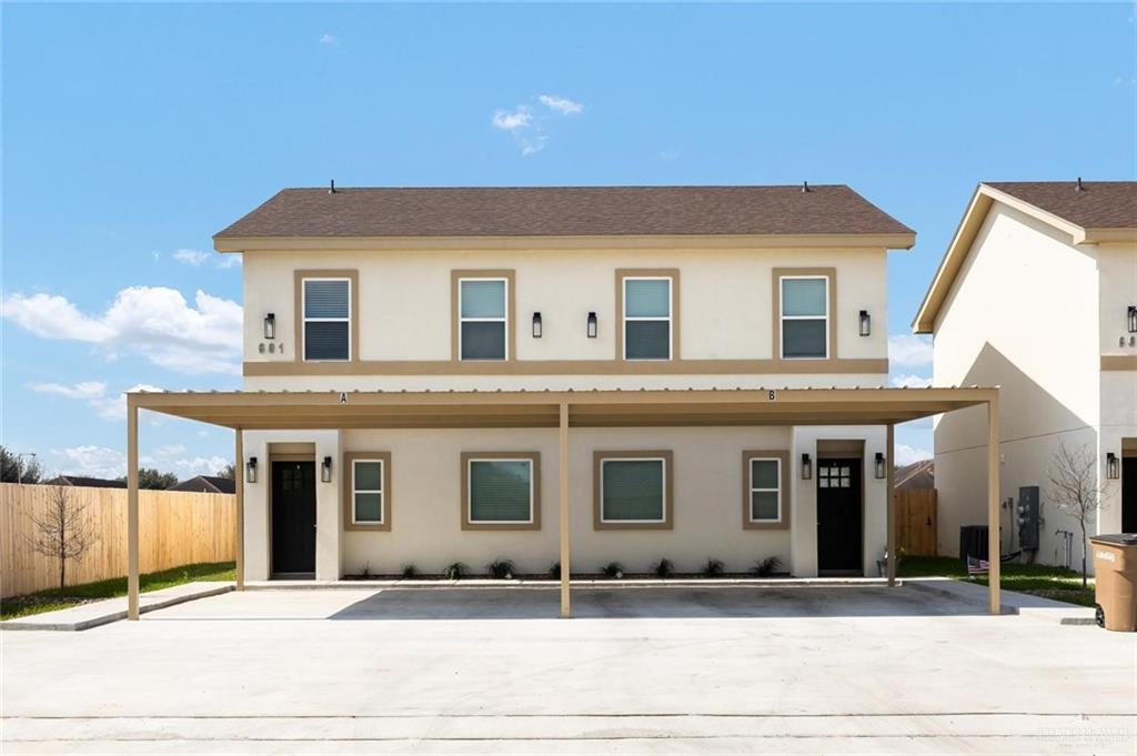 a front view of a house with garage