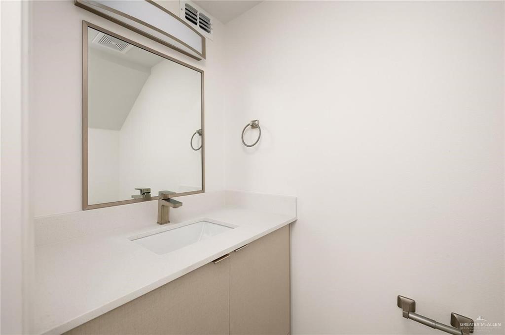 605 Jasper Street, Unit 2 Edinburg, TX 78541 - Photo 4 of 13 a bathroom with a sink and a mirror