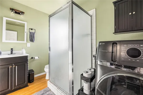 a utility room with closet dryer and washer