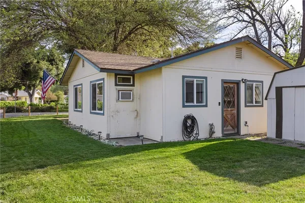front view of a house with a garden