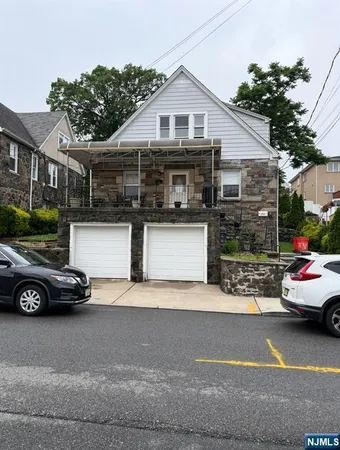 a view of a car parked in front of a house