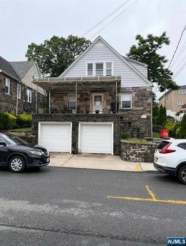 a view of a car parked in front of a house