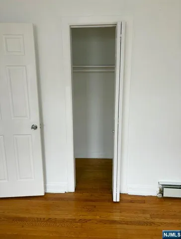 a view of room with wooden floor