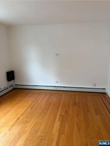 a view of a swimming pool and wooden floor