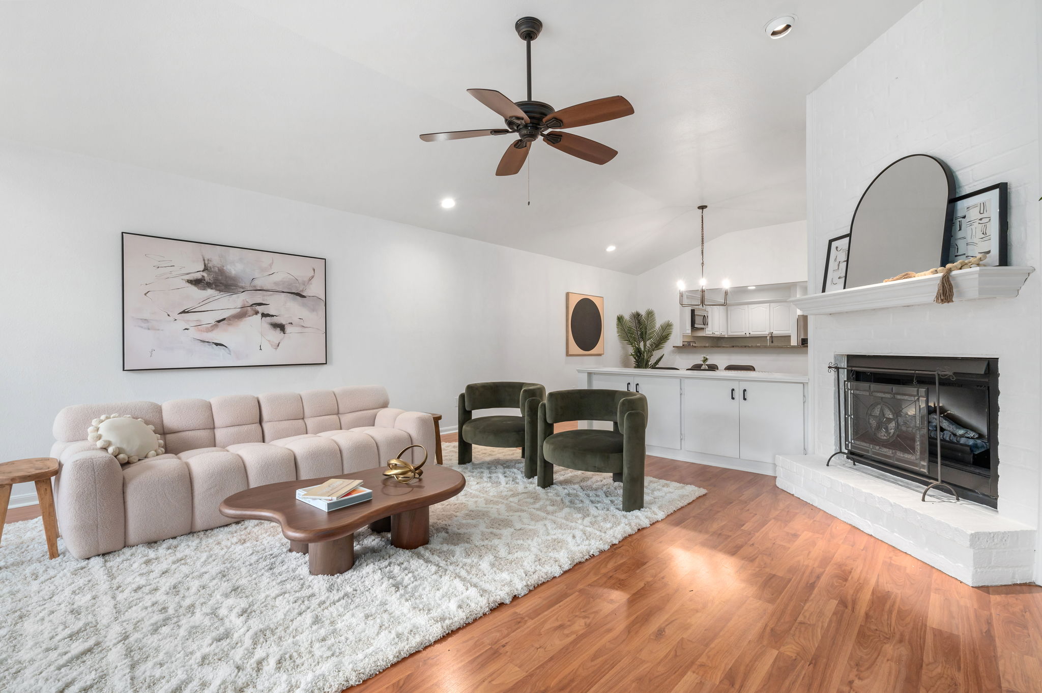 a living room with furniture and fireplace