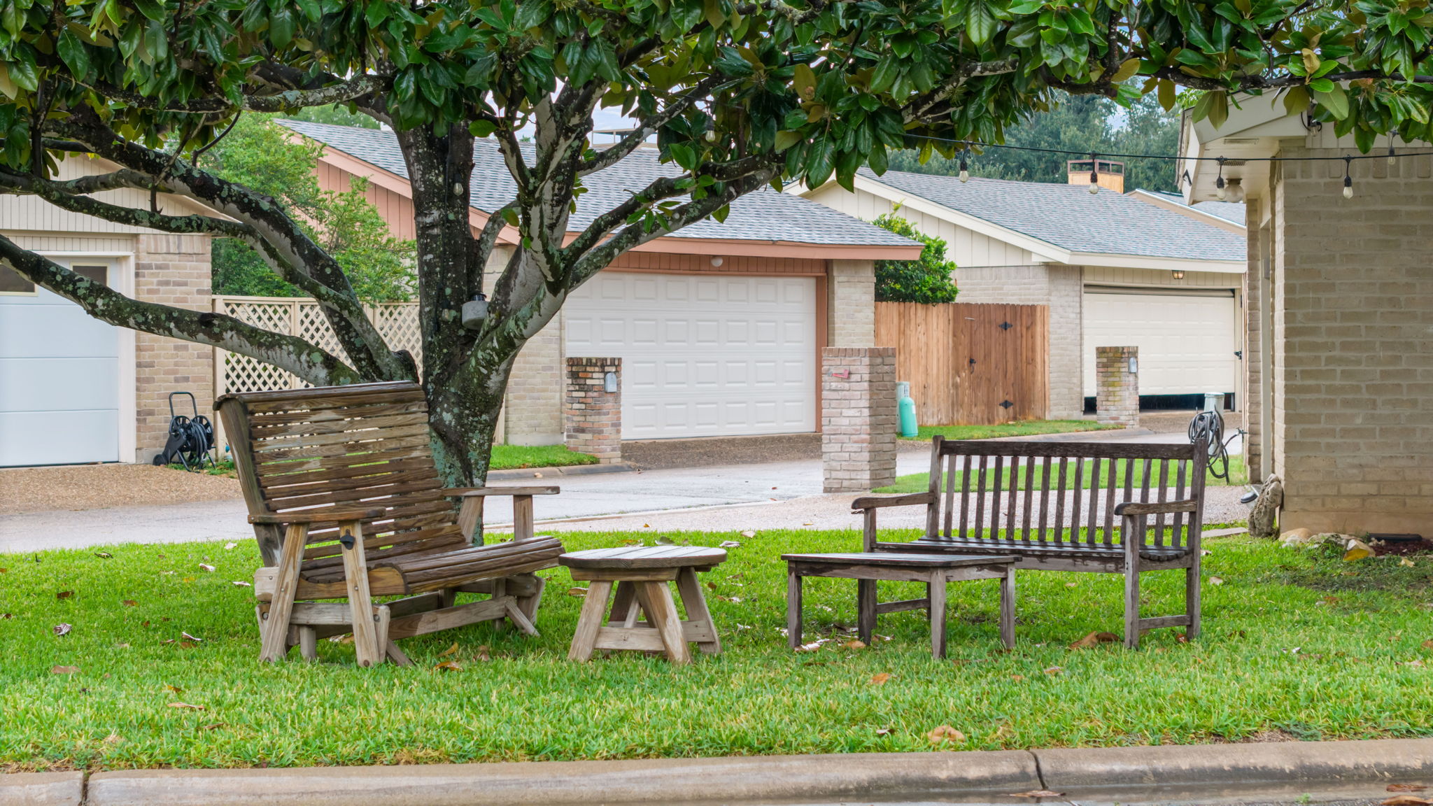 11127 Pinehurst Drive, Unit E Austin, TX 78747 - Photo 21 of 31 a view of a chair and table in backyard of the house