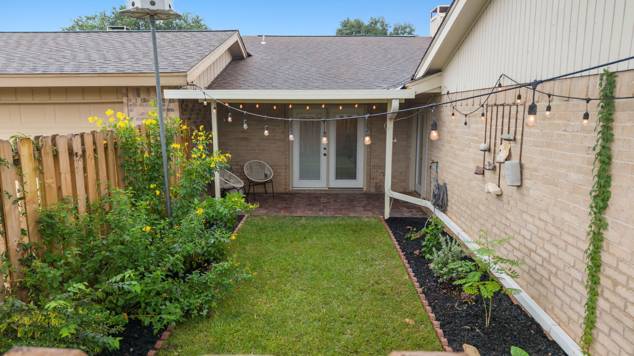 11127 Pinehurst Drive, Unit E Austin, TX 78747 - Photo 23 of 31 a view of a porch with a yard