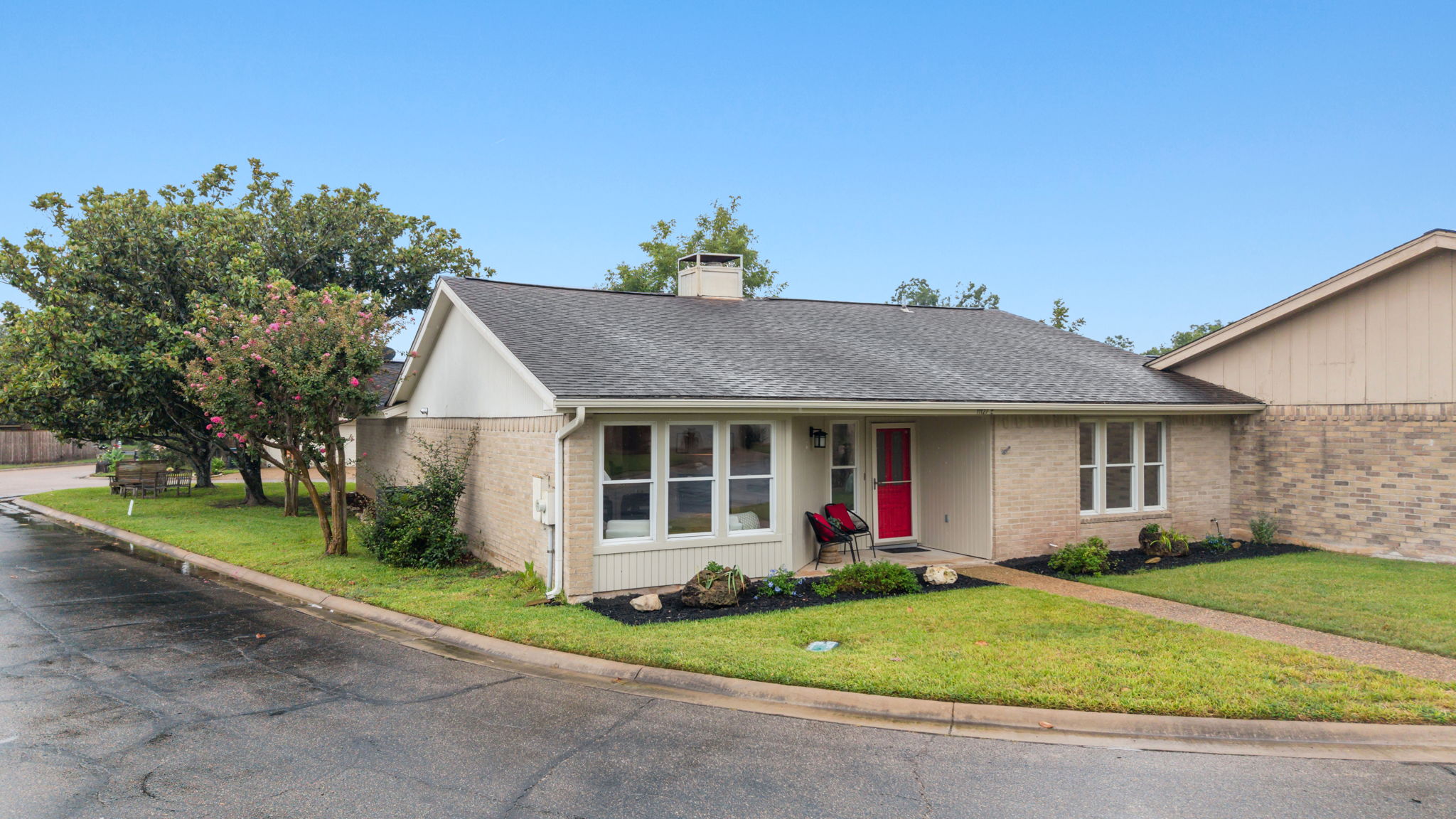 11127 Pinehurst Drive, Unit E Austin, TX 78747 - Photo 27 of 31 front view of a house with a yard