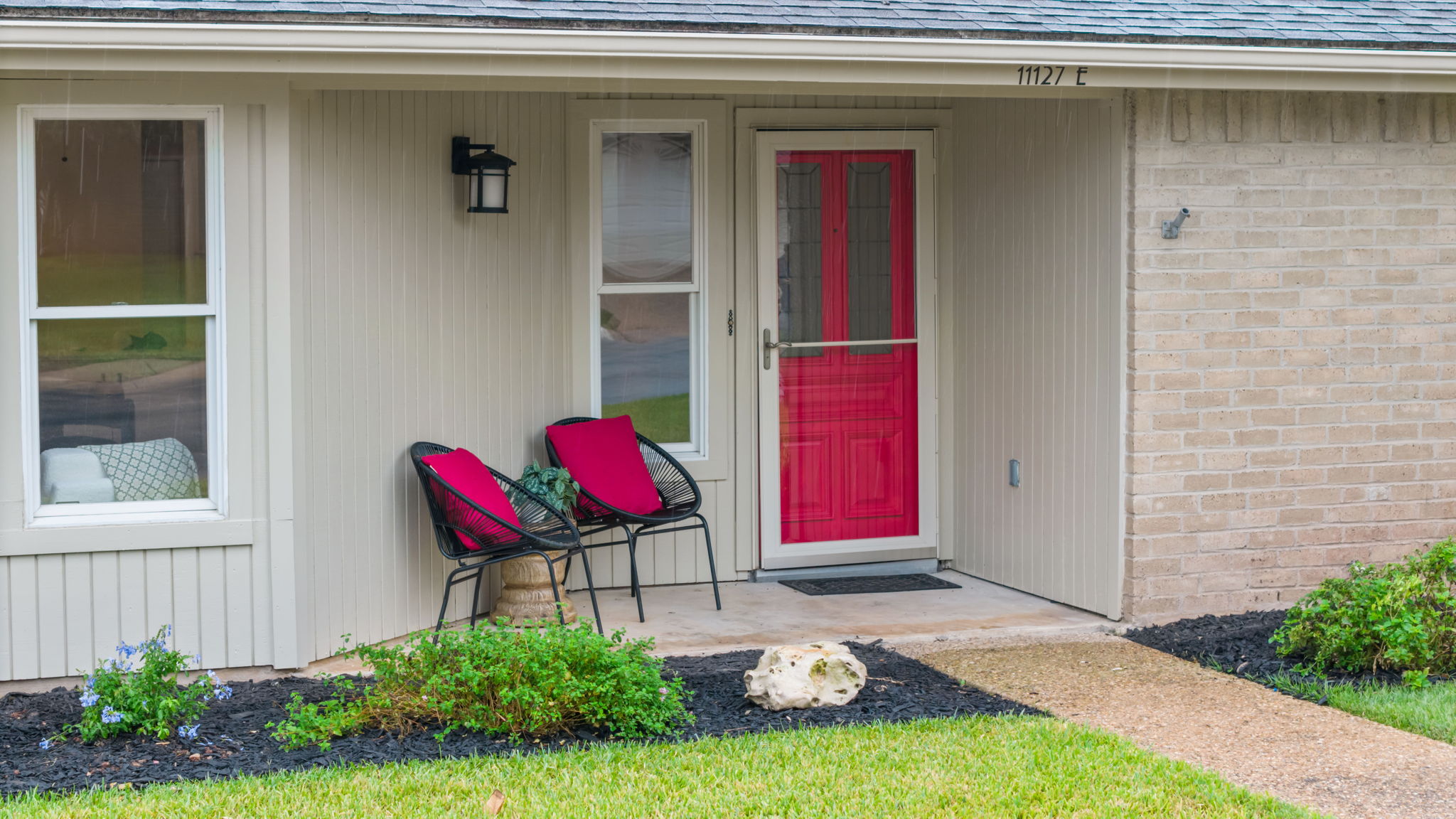 11127 Pinehurst Drive, Unit E Austin, TX 78747 - Photo 28 of 31 a front view of a house with a yard