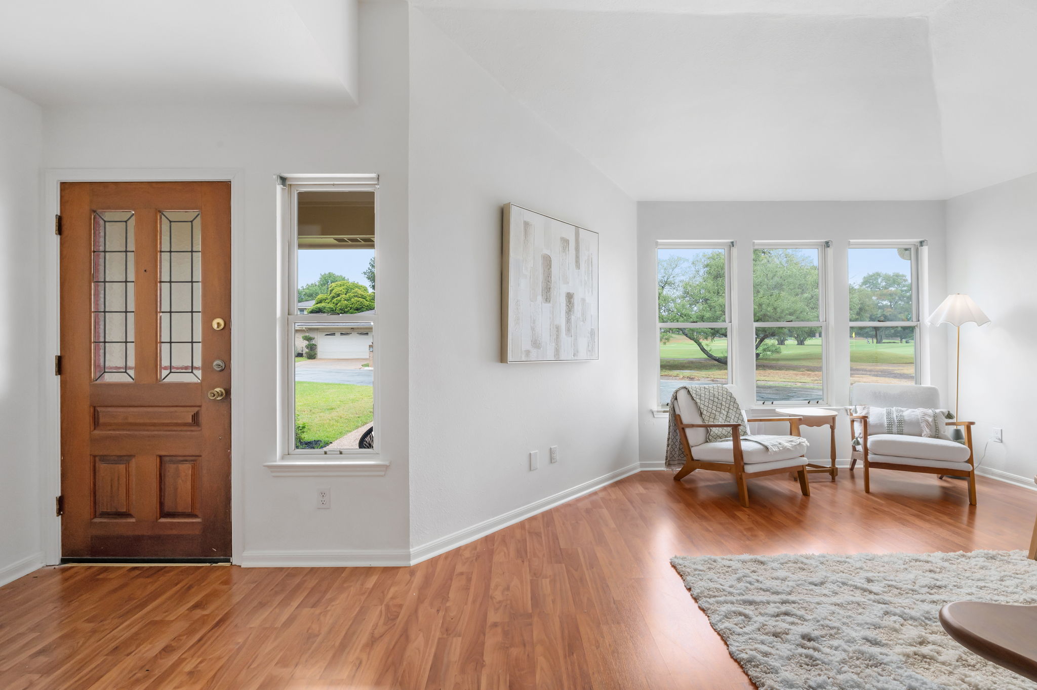 11127 Pinehurst Drive, Unit E Austin, TX 78747 - Photo 4 of 31 a living room with furniture and wooden floor