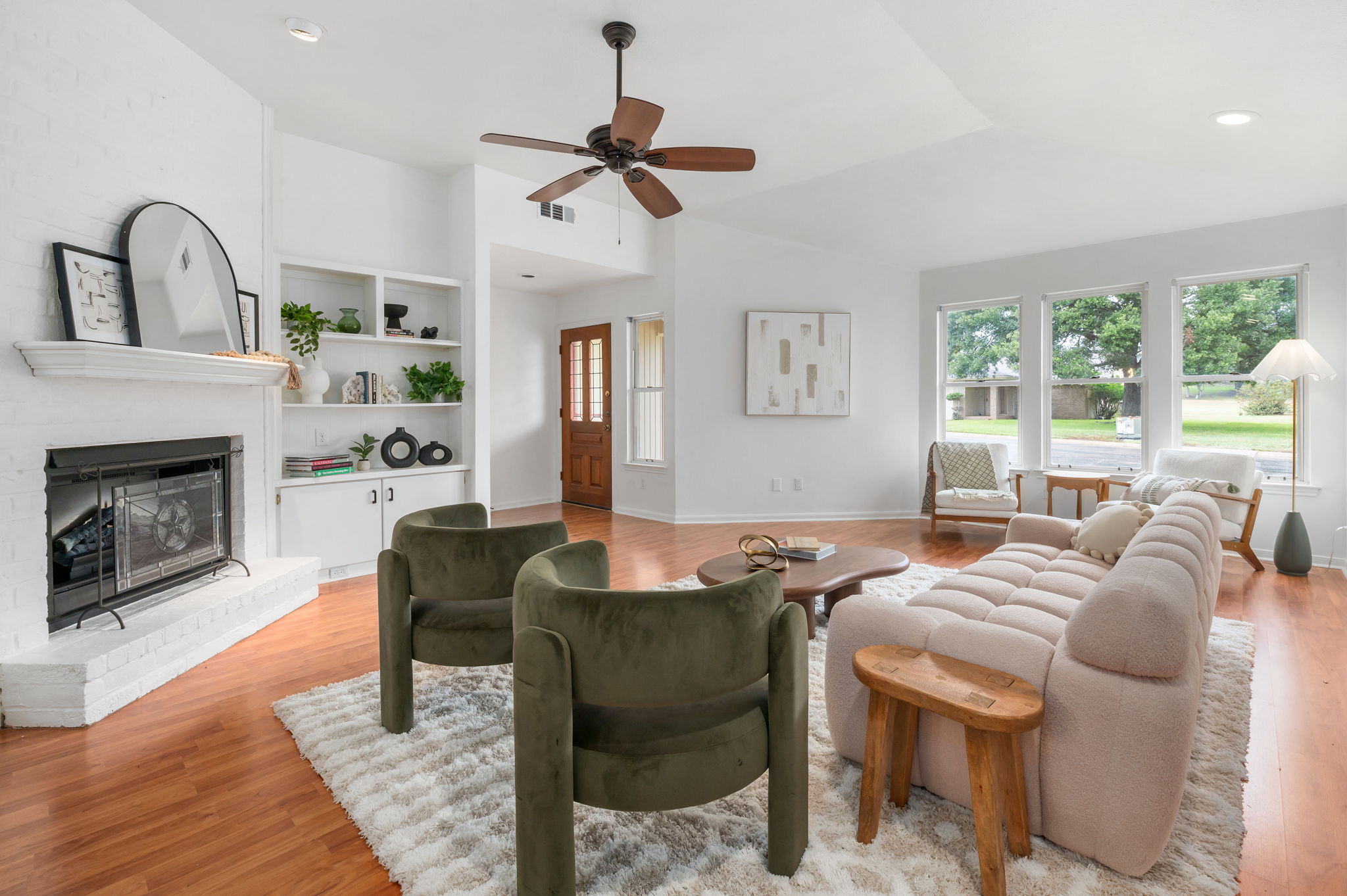 11127 Pinehurst Drive, Unit E Austin, TX 78747 - Photo 5 of 31 a view of a livingroom with furniture and a fireplace