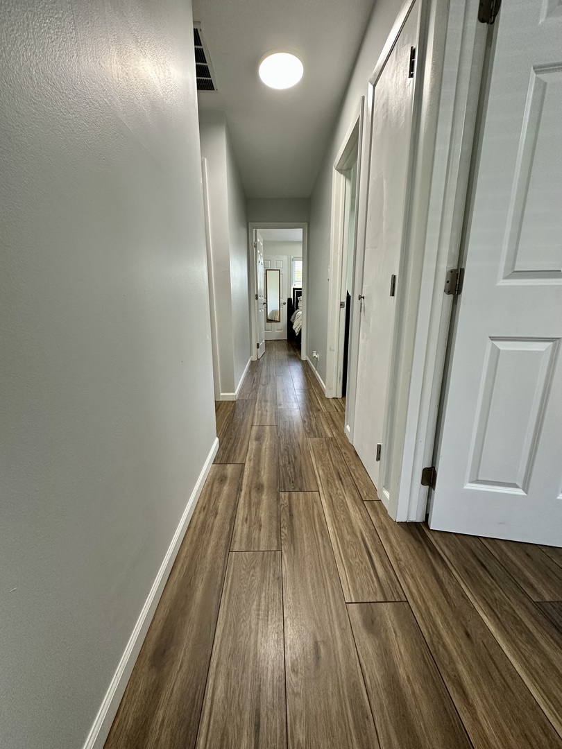 440 Red Bridge Road Lake Zurich, IL 60047 - Photo 18 of 33 a view of a hallway with wooden floor
