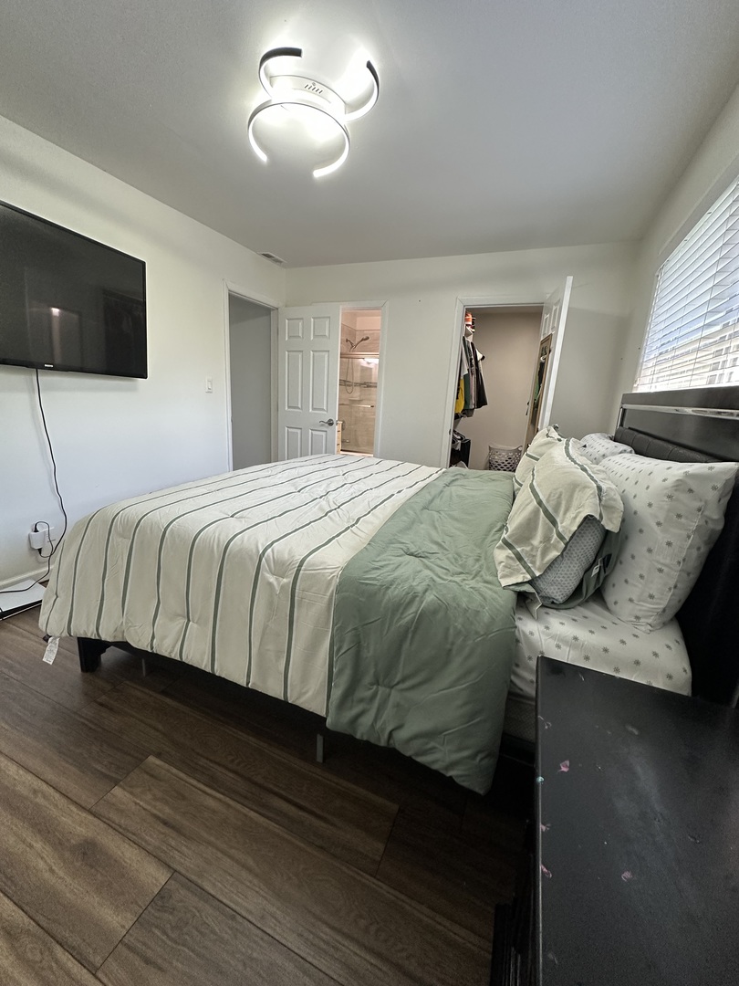 440 Red Bridge Road Lake Zurich, IL 60047 - Photo 20 of 33 a bedroom with a bed and wooden floor