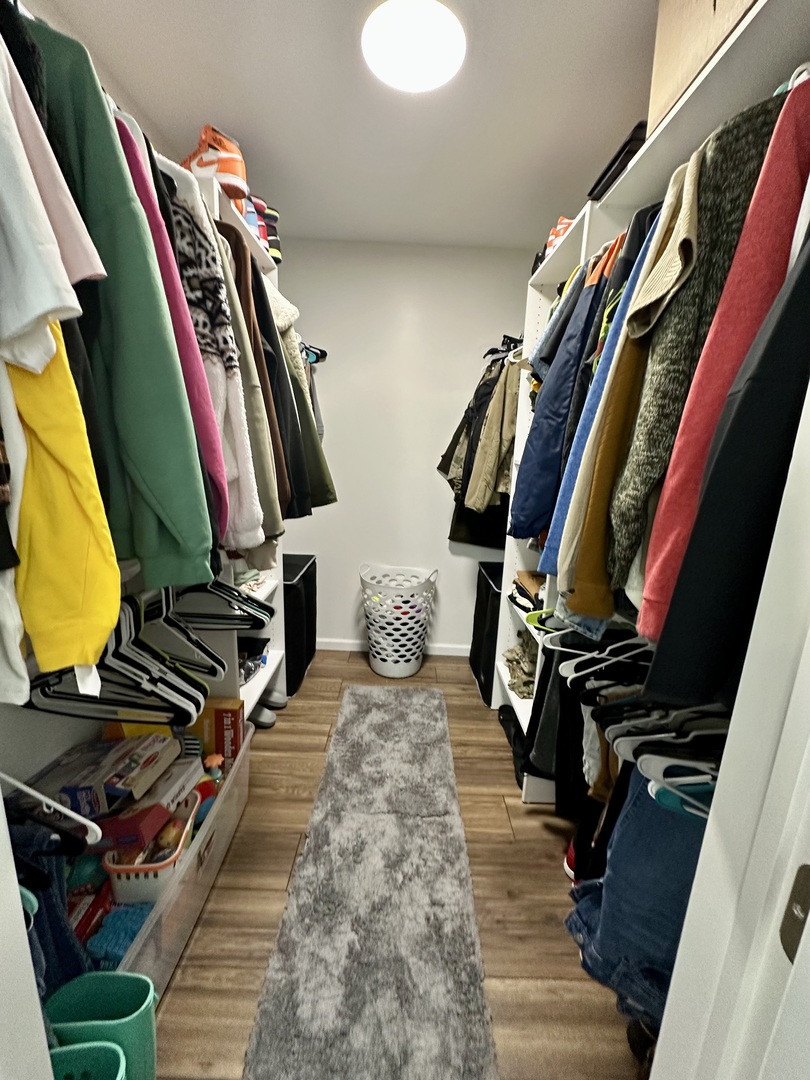 440 Red Bridge Road Lake Zurich, IL 60047 - Photo 22 of 33 a view of walk in closet with clothes and shoes