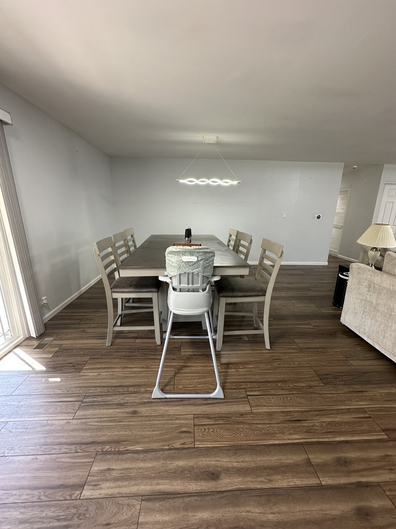 440 Red Bridge Road Lake Zurich, IL 60047 - Photo 6 of 33 a living room with wooden floor and furniture