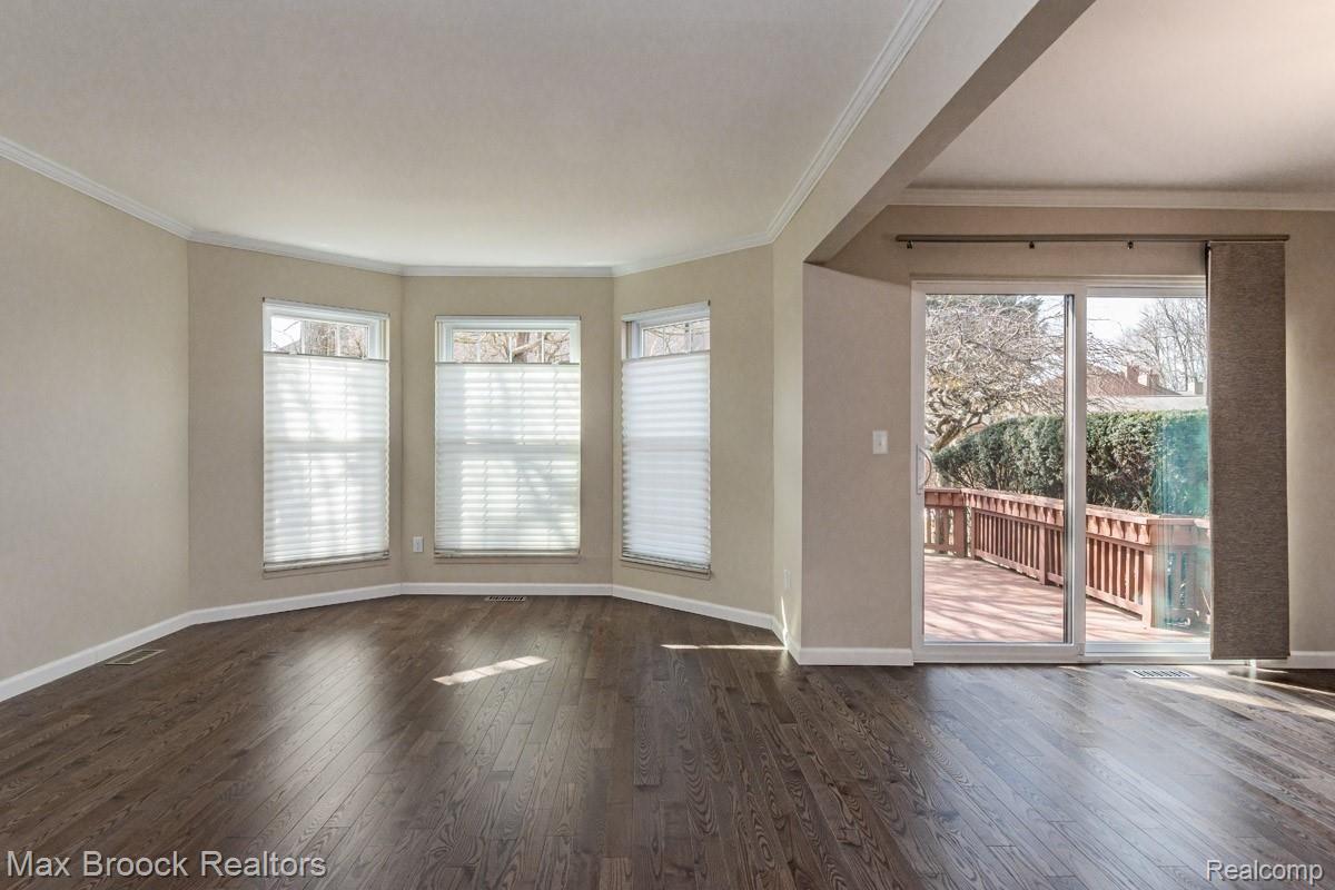 12.jpg  Living rm with Bay window dining room with doorwall to deck