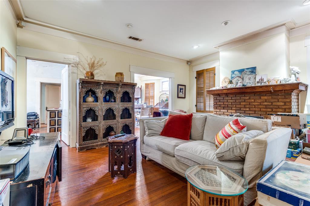 5615 Victor Street Dallas, TX 75214 - Photo 4 of 13 a living room with furniture and a wooden floor