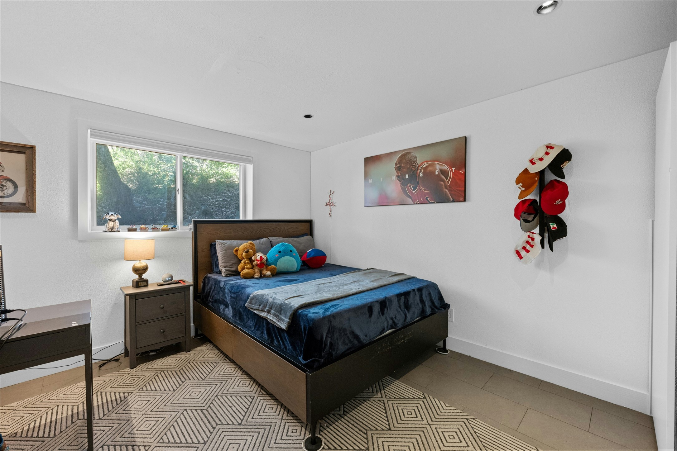 1603 Twilight Ridge Drive Austin, TX 78746 - Photo 20 of 34 a bedroom with a bed and a window