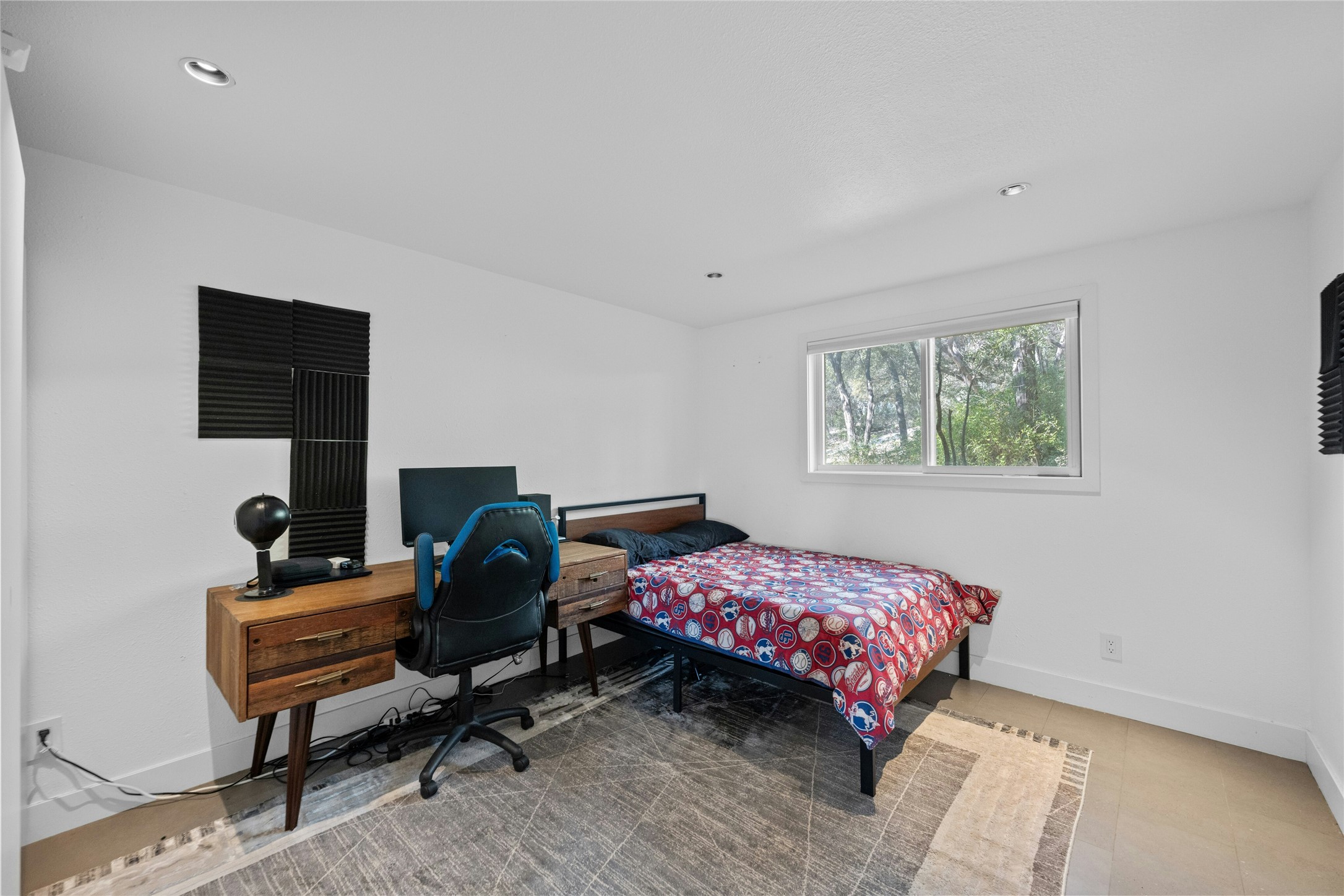 1603 Twilight Ridge Drive Austin, TX 78746 - Photo 23 of 34 a bedroom with a bed and a window