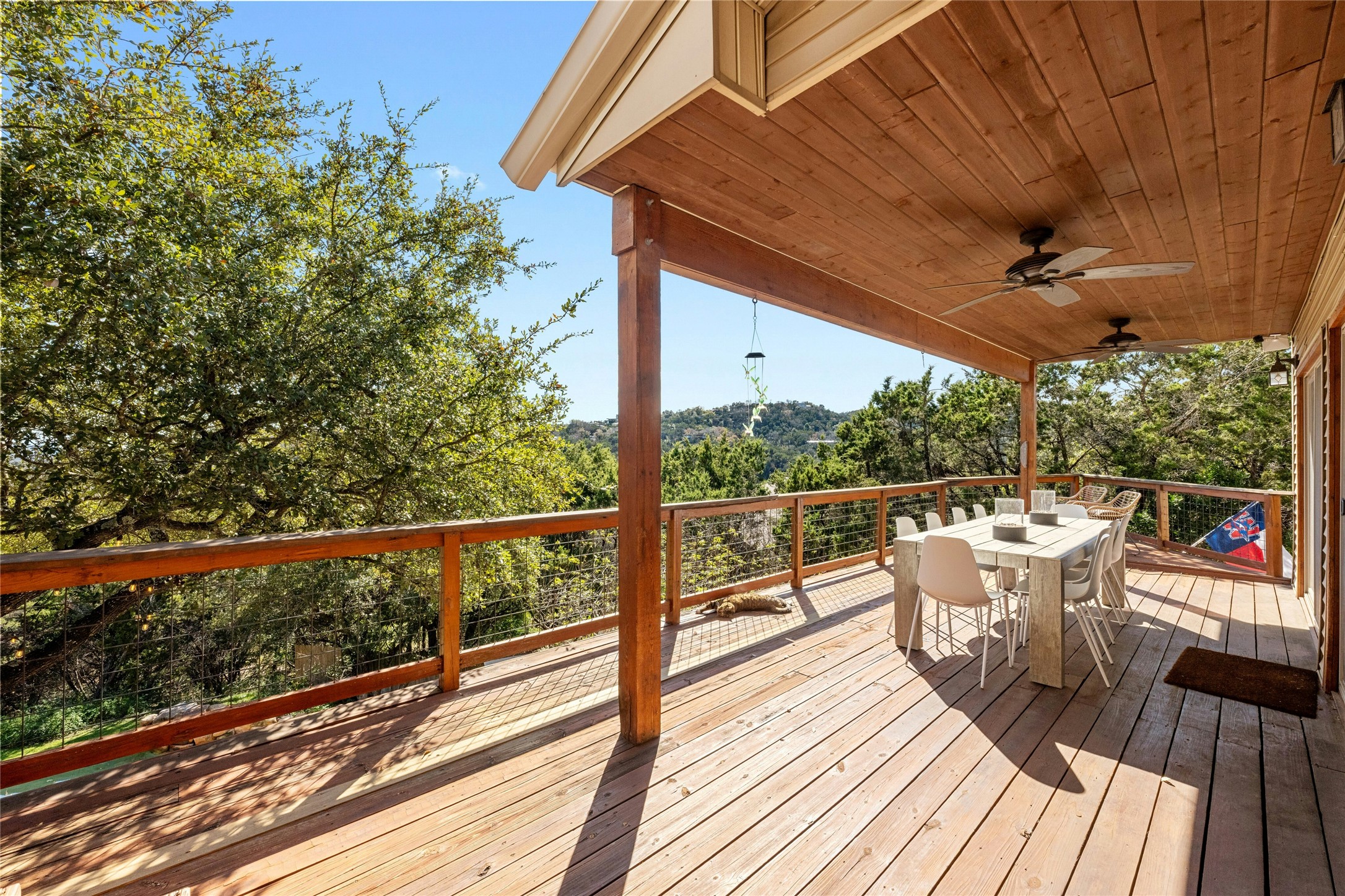 1603 Twilight Ridge Drive Austin, TX 78746 - Photo 25 of 34 a view of a roof deck with wooden floor and fence