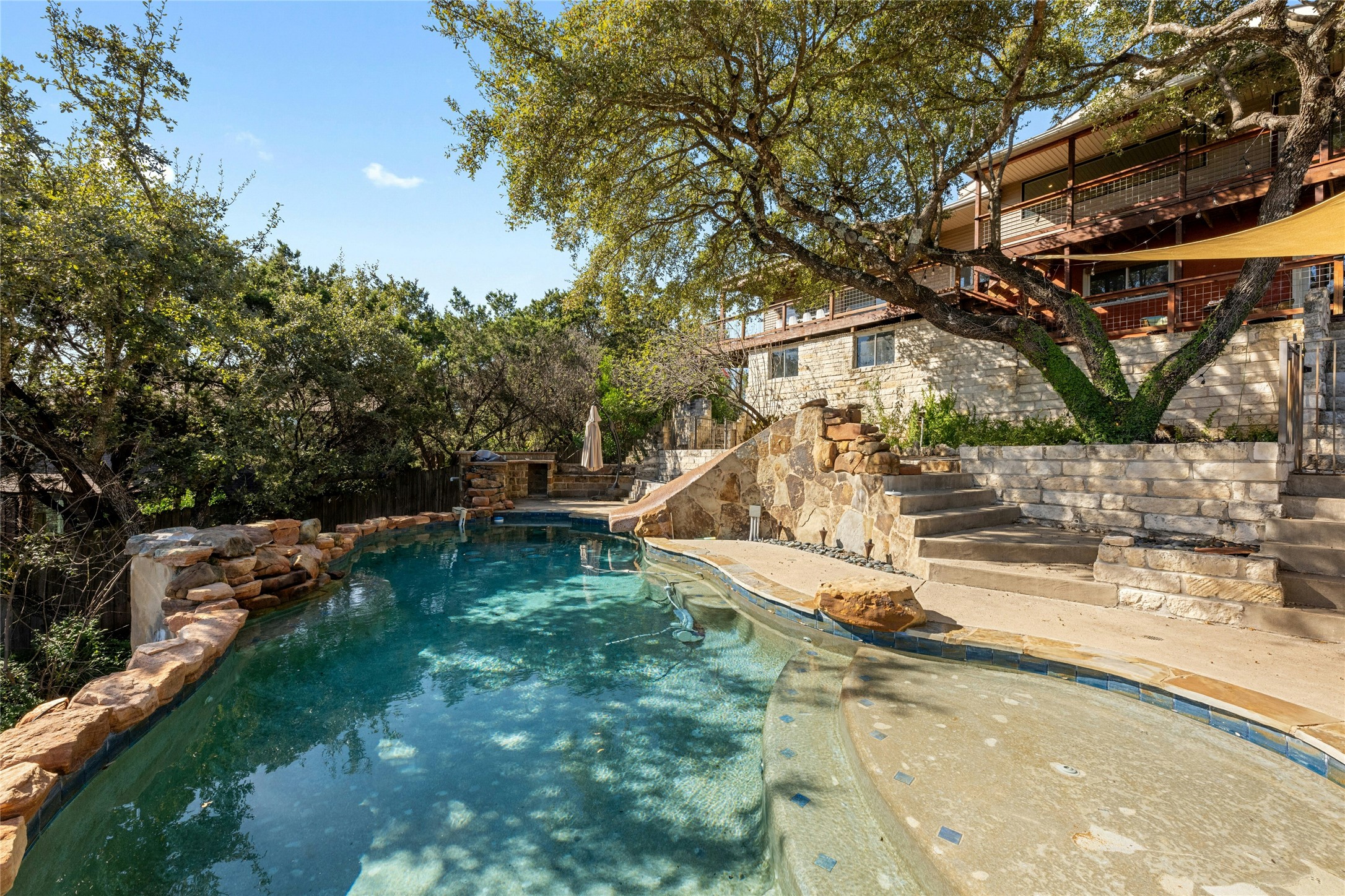 1603 Twilight Ridge Drive Austin, TX 78746 - Photo 29 of 34 a view of a backyard with a lake view