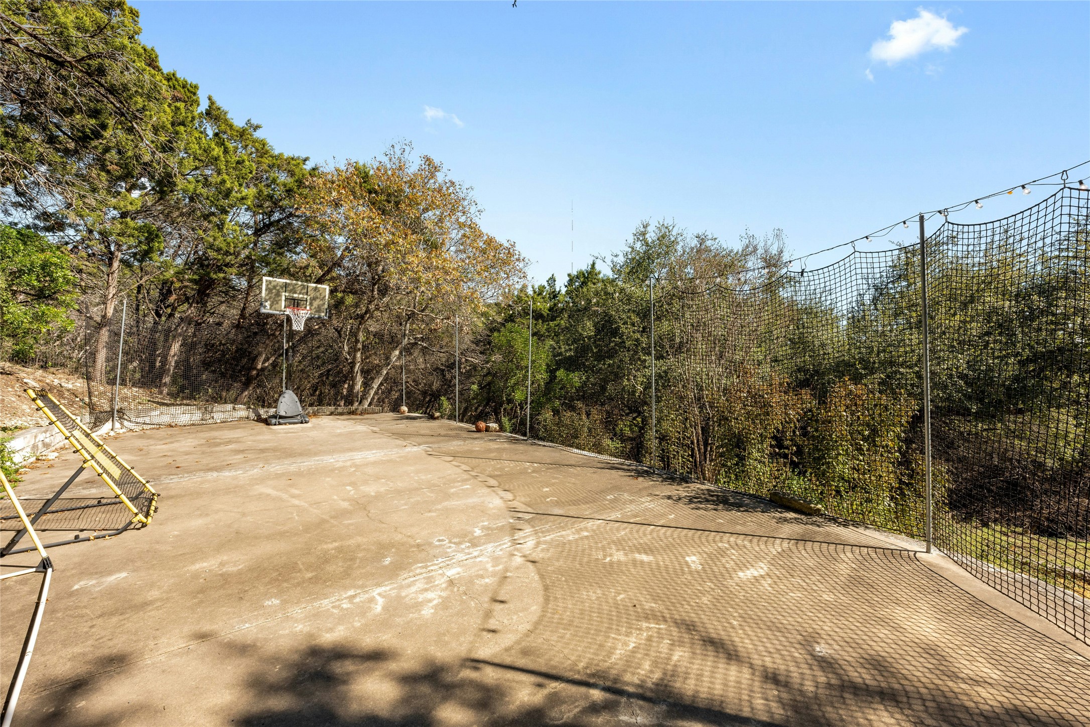 1603 Twilight Ridge Drive Austin, TX 78746 - Photo 32 of 34 a view of a yard with trees in the background