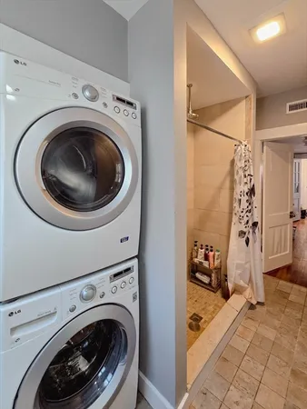a view of a storage & utility room with washer and dryer