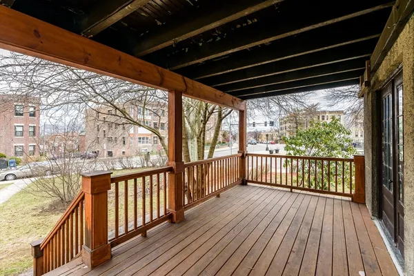 a view of a porch with wooden floor of the house