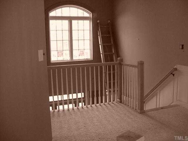 39 High Ridge Court Willow Spring, NC 27592 - Photo 7 of 8 a view of staircase with white walls and a window