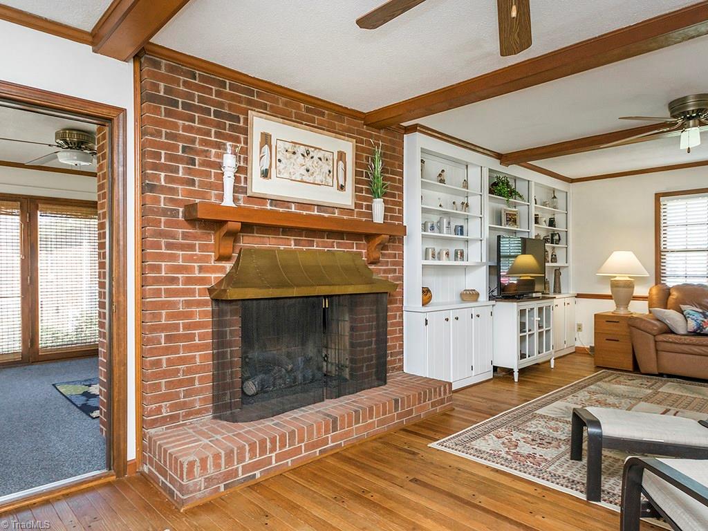 4521 Tower Road Greensboro, NC 27410 - Photo 12 of 28 Den Fireplace with hearth and wide gas logs.
