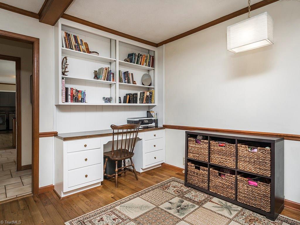 4521 Tower Road Greensboro, NC 27410 - Photo 15 of 28 Built-in desk or work space in the den.