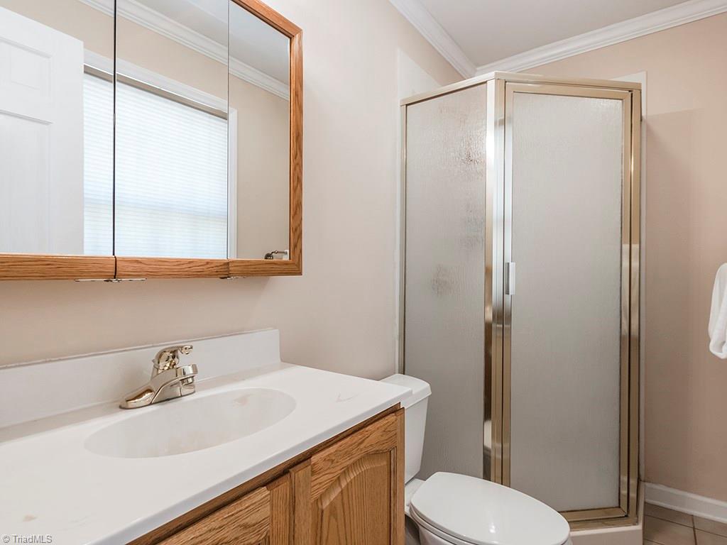 4521 Tower Road Greensboro, NC 27410 - Photo 20 of 28 Master bath with walk-in shower.