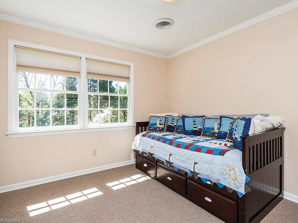 4521 Tower Road Greensboro, NC 27410 - Photo 22 of 28 Bedroom #3 has hardwoods under the carpet