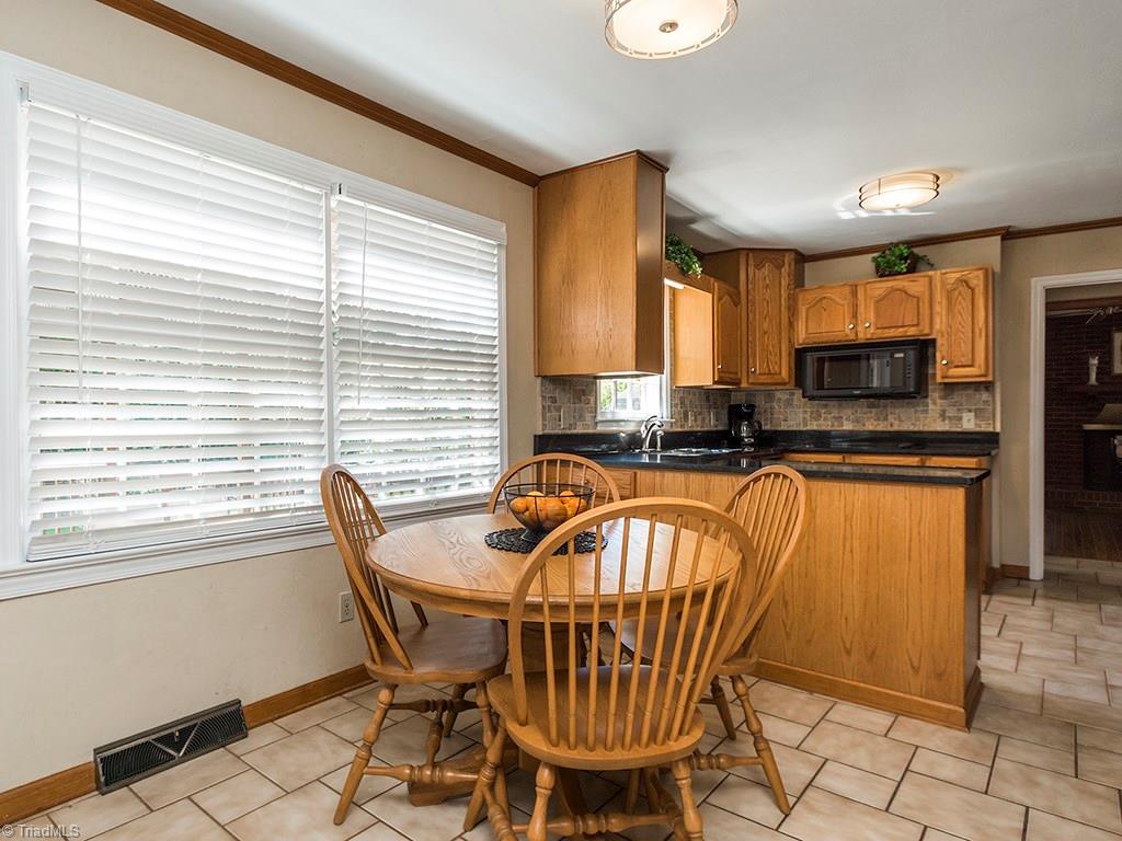 4521 Tower Road Greensboro, NC 27410 - Photo 7 of 28 Breakfast area facing the kitchen.