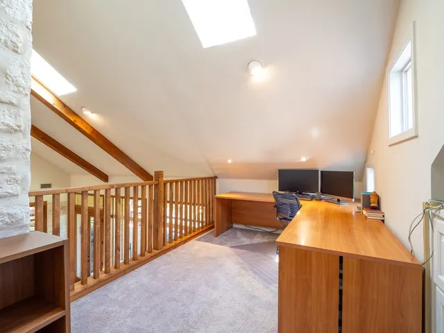 a view of a kitchen with a sink and cabinets