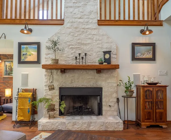 a living room with furniture and a fireplace