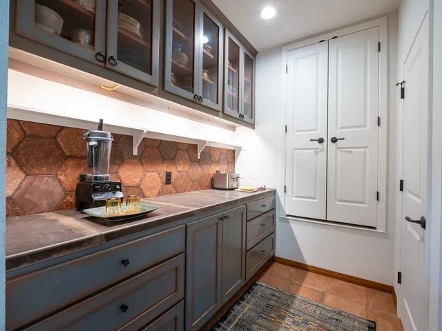 a kitchen with stainless steel appliances granite countertop a sink and cabinets