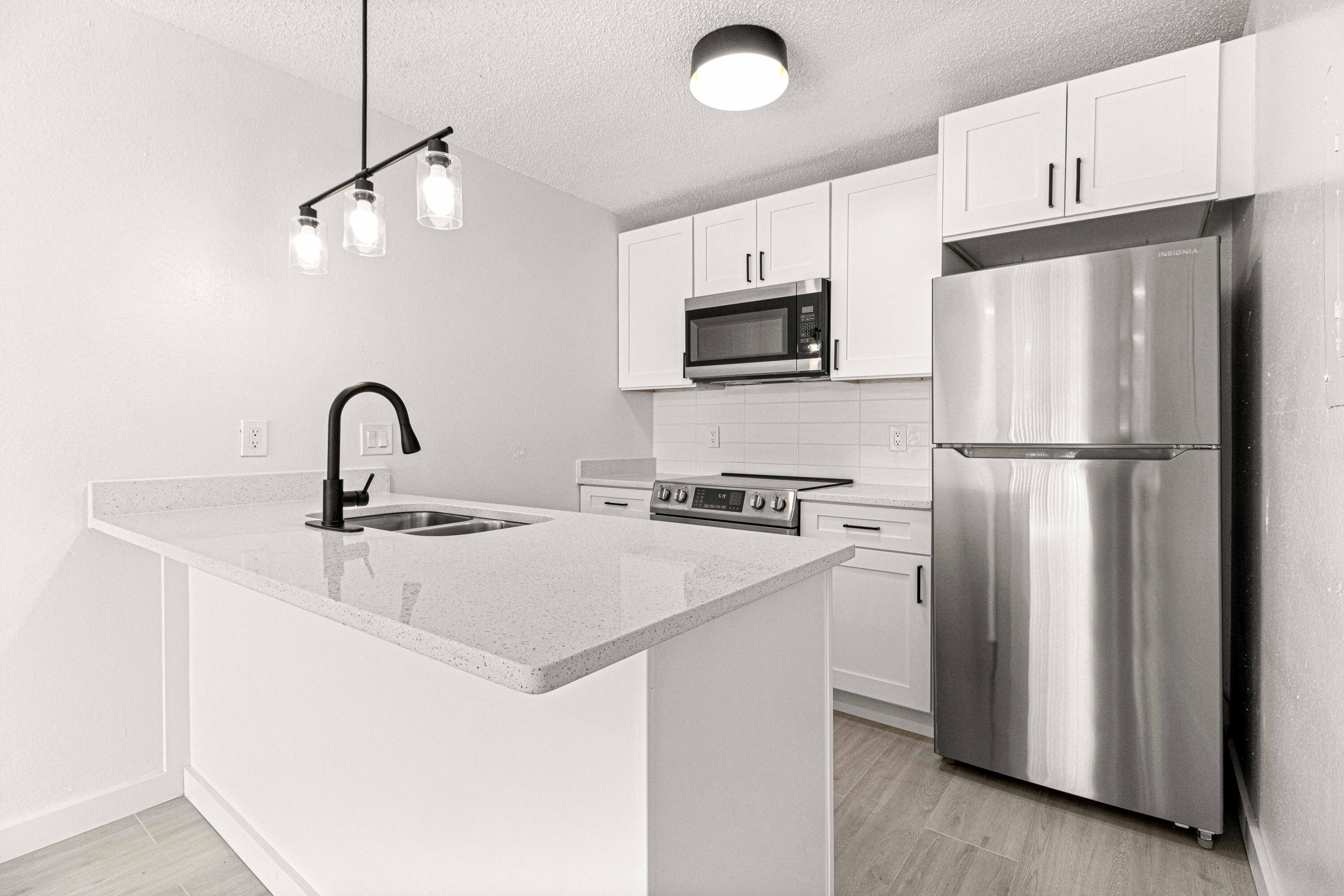 5320 Southeast 28th Lane Ocala, FL 34480 - Photo 13 of 21 a kitchen with appliances a sink and cabinets