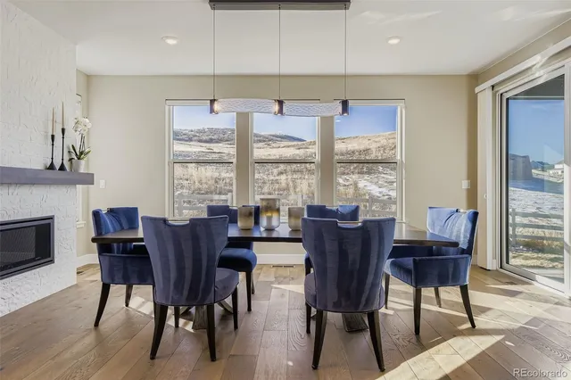 a view of a dining room with furniture window and wooden floor