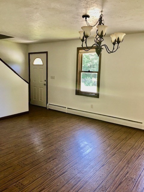 147 East County Road, Unit 147 Rutland, MA 01543 - Photo 7 of 17 a view of room with window and wooden floor