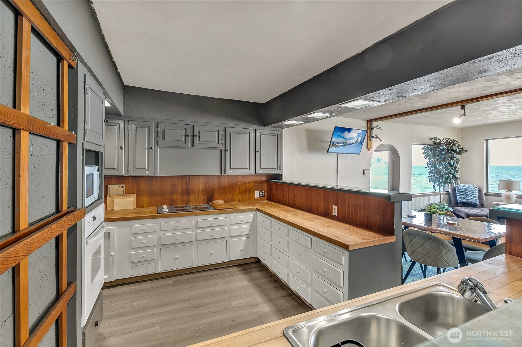 14024 Glen Acres Road Southwest Vashon, WA 98070 - Photo 12 of 40 a kitchen with stainless steel appliances granite countertop a sink and cabinets