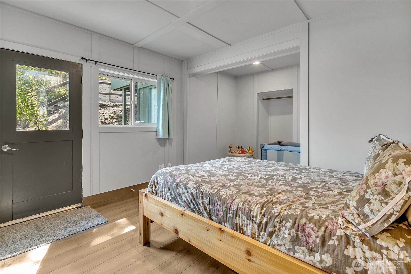 14024 Glen Acres Road Southwest Vashon, WA 98070 - Photo 13 of 40 a bedroom with a bed and a window