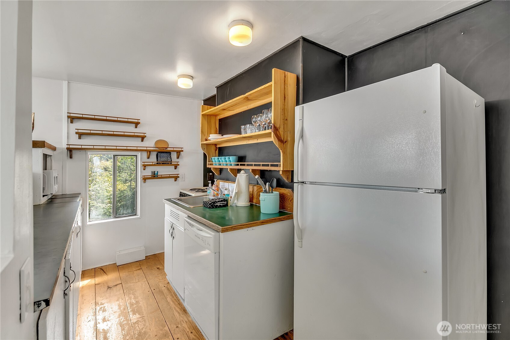 14024 Glen Acres Road Southwest Vashon, WA 98070 - Photo 20 of 40 a kitchen with stainless steel appliances a refrigerator and a stove