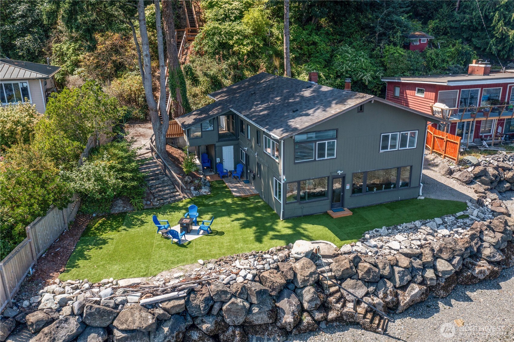 14024 Glen Acres Road Southwest Vashon, WA 98070 - Photo 2 of 40 a view of a house with a yard and potted plants