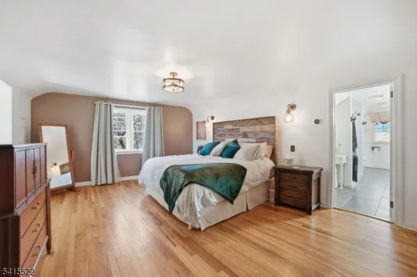 a bathroom with a sink vanity mirror and toilet